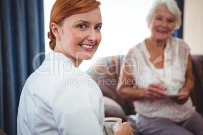 Portrait of a nurse looking behind her