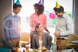 Business people celebrating birthday