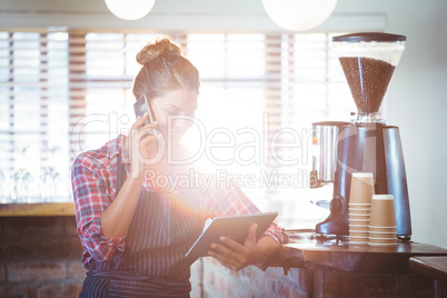 Waitress making a phone call