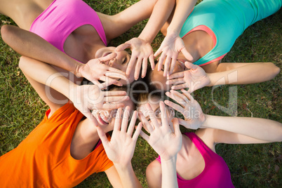 Beautiful young women lying on grass