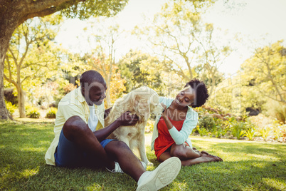 Couple posing with a dog