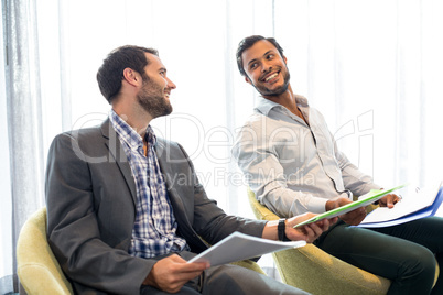 Businessman interacting with coworker