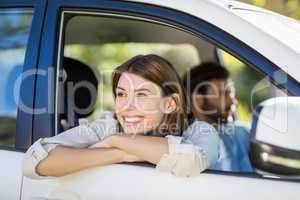 Thoughtful woman looking out from car window