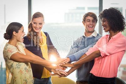 Business people forming hands stack