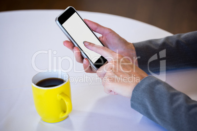 Woman taking a picture of coffee