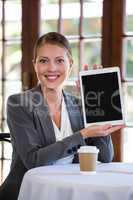 Woman presenting a tablet