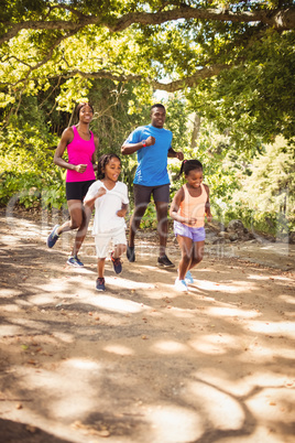 Happy family running together