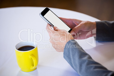 Woman taking a picture of coffee