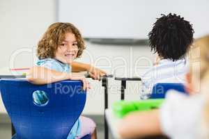 Schoolboy smiling in classroom