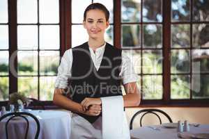Waitress with napkin draped over her hand