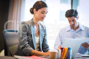 Businesswoman working on laptop