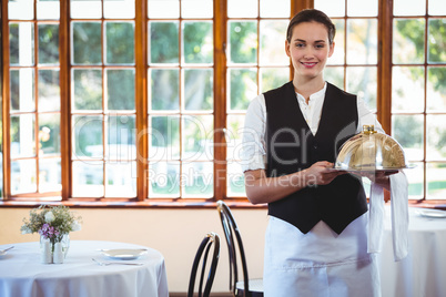 Waitress holding a dish