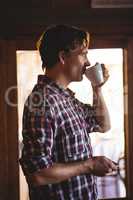 Man drinking coffee alone