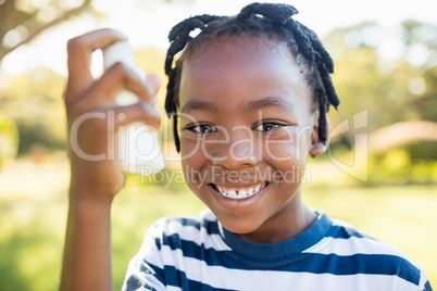 Kids holding an object and smiling