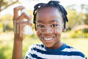 Kids holding an object and smiling