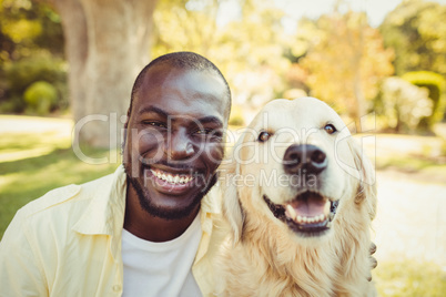 Man posing with a dog