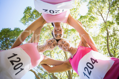 Young athlete women forming huddles