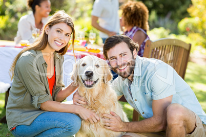 Smiling couple with the dog