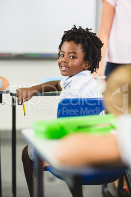 Schoolboy smiling in classroom