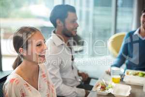 Business people having breakfast