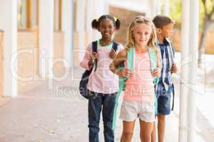 School kids standing in school corridor