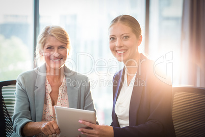 Businesswomen holding digital tablet