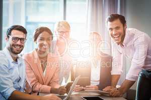 Business people holding laptop, mobile phone and digital tablet