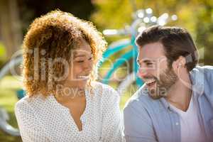 Couple smiling in park