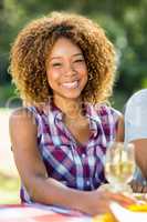 Portrait of woman holding wine glass and smiling