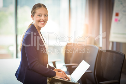 Businesswoman using laptop