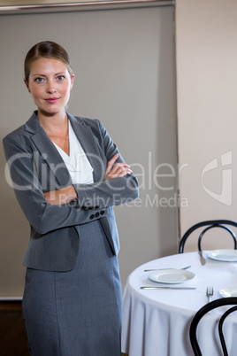 Woman standing with arms crossed