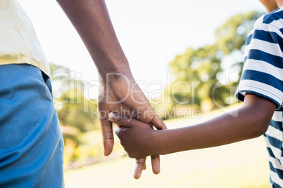 Focus on hands of son and father