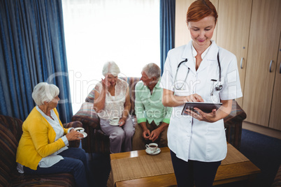 Portrait of a smiling nurse with seniors