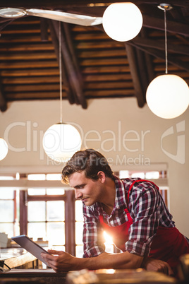 Waiter using digital tablet