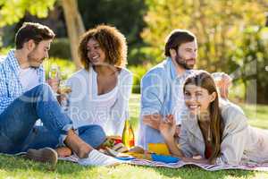 Group of friends having wine with breakfast