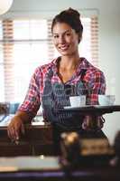 Waitress holding coffees