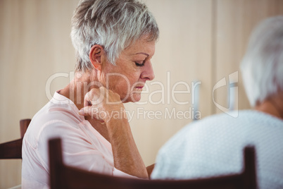 Side of a senior looking sad woman