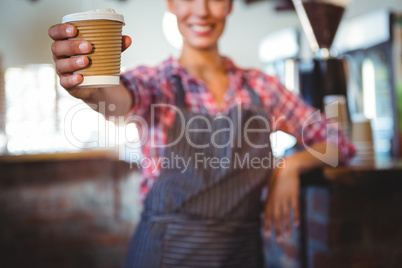 Waitress holding a cup of coffee