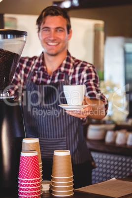 Waiter handing over a coffee