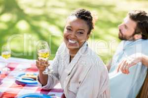 Woman holding wine glass and smiling