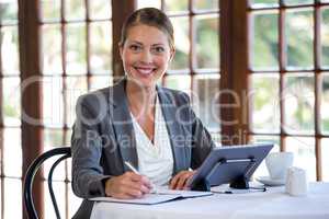 Woman writing in a notebook