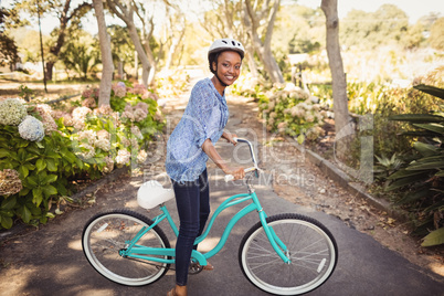 Happy woman doing bicycle