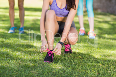 Woman tying shoe lace