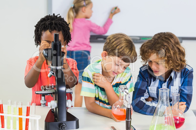 Kids doing experiment in laboratory