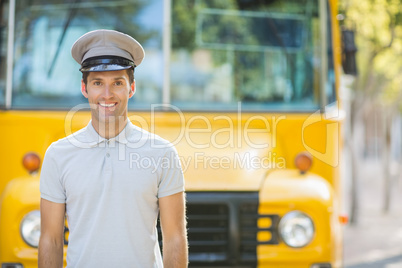 Bus driver smiling in front of bus