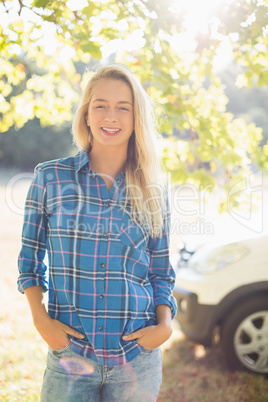 Beautiful woman standing with hands in pocket