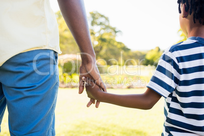 Focus on hands of son and father