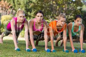 Women exercising with dumbbells