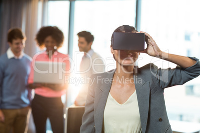 Businesswoman wearing virtual glasses