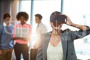Businesswoman wearing virtual glasses